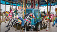 Cash Cotton Enjoying A Ride On A Semi-creepy Carousel