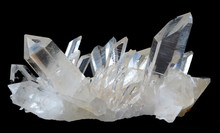A Cluster Of Transparent Quartz Crystals Isolated On A Black Background