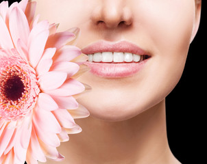 Beautiful female mouth with flower.