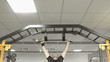 © lenblr - Athlete muscular fitness male pulling up on horizontal bar in a gym