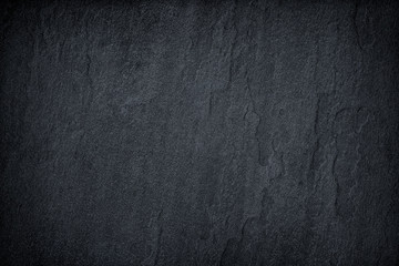 dark grey black slate background or texture.