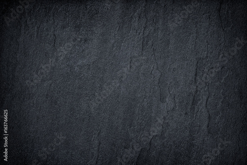 Foto Dark grey black slate background or texture.