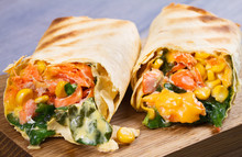 Salmon, Spinach, Cheddar Cheese And Corn Burritos. Fish Wraps. View From Above, Top Studio Shot