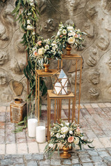 decorated wedding area with flowers on wooden background