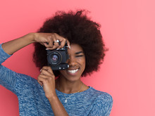 Young Black Girl Taking Photo On A Retro Camera