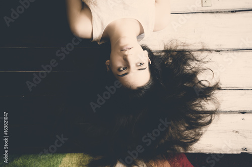 Teenage Girl With Long Hair Lying Upside Down Girl With