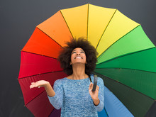 African American Woman Holding A Colorful Umbrella