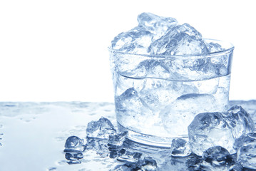 Wall Mural - water with ice cubes in glass. isolated on white, copy space