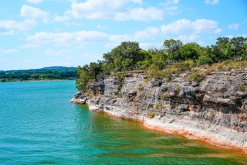 lake travis in texas has some incredible cliffs on the edge of the lake to climb or jump into the wa