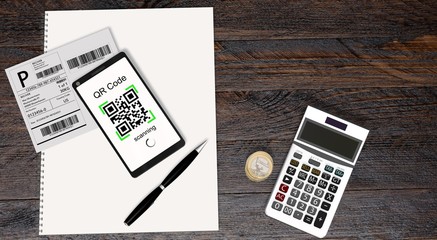 Wall Mural - QR Code scanning from a shipping stickers with modern touchscreen smartphone 