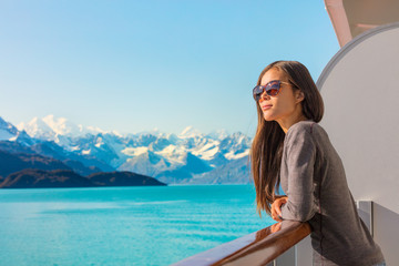 Wall Mural - luxury travel alaska cruise holiday woman relaxing on balcony looking at view of mountains and natur