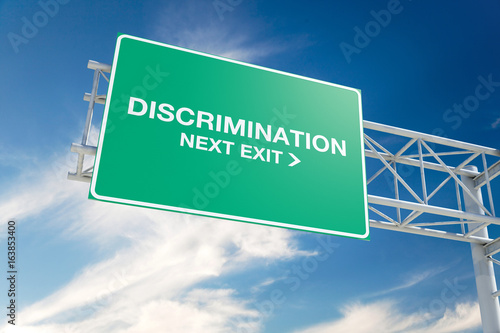 Fotografía Discrimination 3D Highway Sign on Blue Sky with Cloudscape