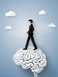 © kengmerry - Concept of leader vision and thinking, business man walking on the brain gear,paper art and craft style