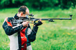 © Microgen - Man practicing for competition sport shooting with free rifle