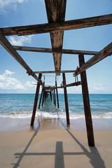 Wall Mural - The old bridge was long out to sea in Thailand.