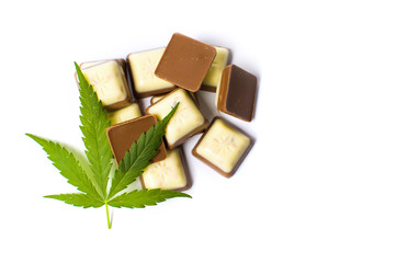 Wall Mural - Marijuana leaf on top of chocolate pieces