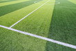 © Fotoglee - Photo of a green synthetic grass sports field with white line shot from above