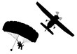 Bottom profile silhouette of sky diver with open parachute and airplane