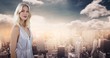 Woman with grey dress against skyline with clouds