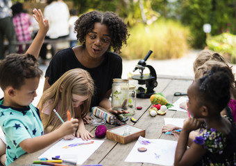 Wall Mural - Group of kids classmates learning biology drawing class