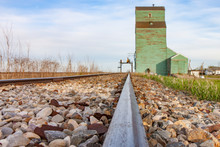 Rails Leading To Old Green Grain Elevator