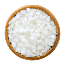 White Onion Cubes In Wooden Bowl. Chopped Fresh, Raw Allium Cepa, Also Bulb Or Common Onion. Vegetable, Ingredient And Staple Food. Isolated Macro Food Photo Close Up From Above On White Background.