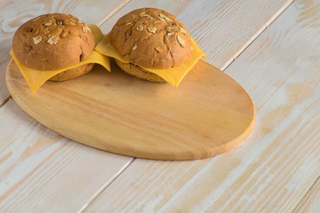 bread buns on wooden board