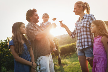 Wall Mural - Winemaker family together in vineyard