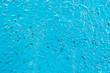 Peeling blue paint on the metal surface covered with rust texture. Copy space ready for your background design. Craquelure