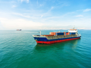 container,container ship in import export and business logistic.By crane , Trade Port , Shipping.Tugboat assisting cargo to harbor.Aerial view.Water transport.International.Shell Marine.