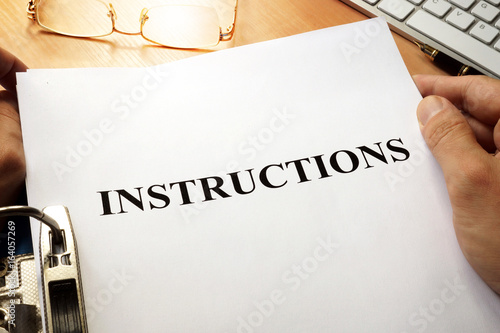 Instructions in a blue folder. Guidebook concept. Tableau sur Toile