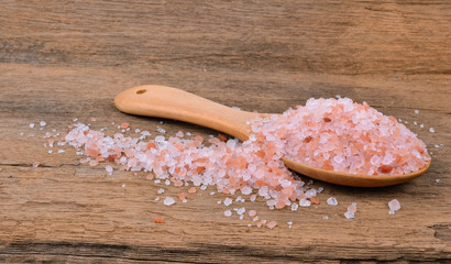 Himalayan salt on old wooden table (salt)