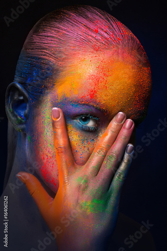 Model with colorful art make-up, close-up