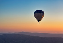 Hot Air Balloon Flight At Sunrise.