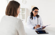 © Syda Productions - doctor with clipboard and woman patient at clinic
