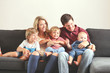 © MeganBetteridge - Young family with three boys lifestyle at home on the couch playing together