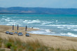 Beach seascape with umbrellas, chairs and beds. Seascape of Termoli, Molise, in Italy. windy day and waves in the sea.
