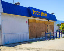 Failed Store With Boarded Up Windows