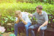 American businessmen consoling friend. Frustrated young man being consoled by his friend in garden.