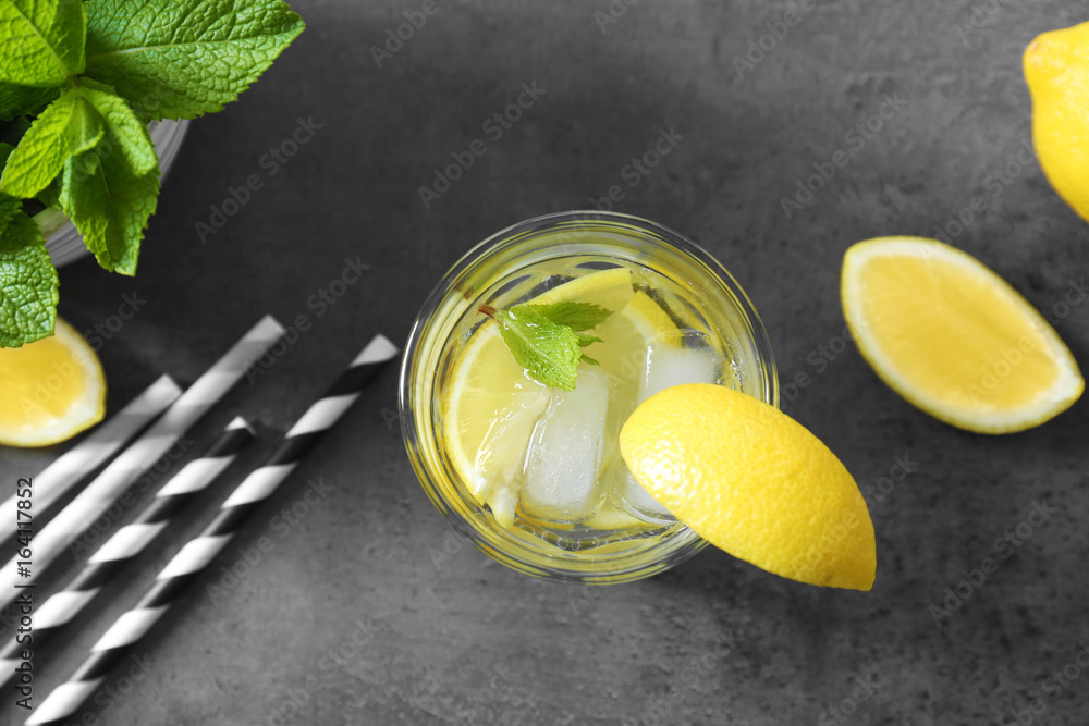 Glass of fresh lemonade on grunge background