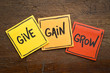 give, gain and grow concept in sticky notes