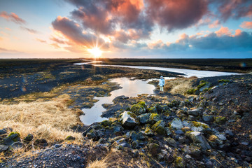 Wall Mural - Beautiful black volcanic river landscape of Myrdalssandur in the southern part of Iceland at sunrise in winter. 