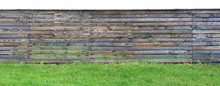 Long Old Solid  Solid Wooden Rural  Fence Made From Brown Pine Planks.