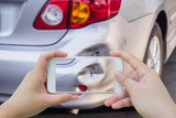 Fototapeta  - woman using mobile smartphone taking photo of car accident damaged for insurance