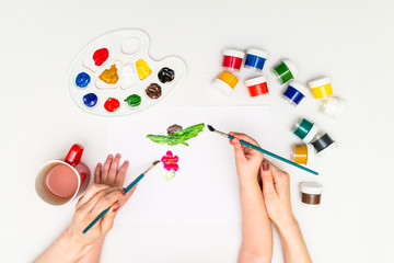 Wall Mural - Child painting a flower