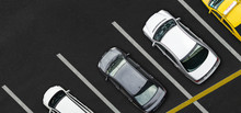 Top View Of Cars On Parking Lot