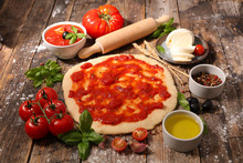 Cooking Pizza With Tomato Sauce,mozzarella And Basil