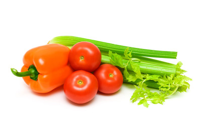 Tomatoes, celery and peppers isolated on white background.