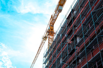 Construction crane on construction site. Building. Skyscraper