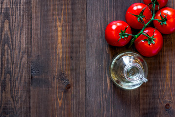 Prepring for cooking dinner. Tomato on wooden table background top view copyspace